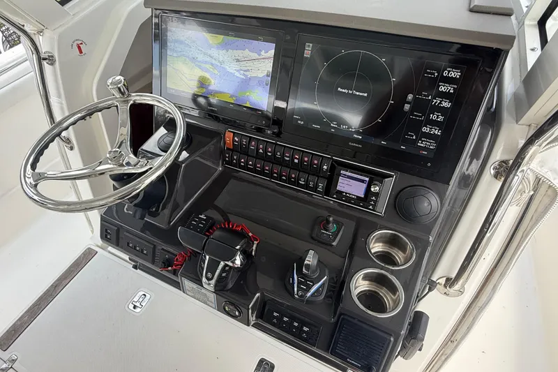 Slide: The Image of 2022 Pursuit S 378 Sport boat dashboard with advanced navigation and control systems. - 42