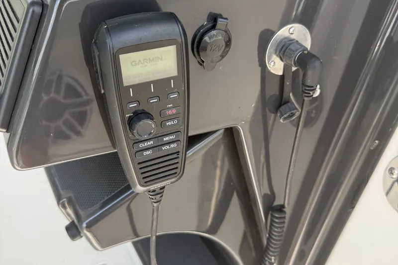 Slide: The Image of Garmin marine radio on 2022 Pursuit S 378 Sport boat dashboard. - 46