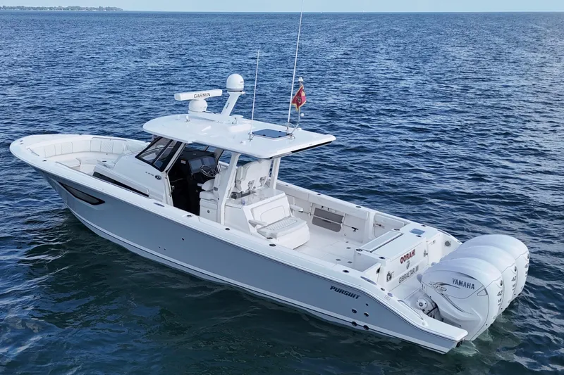 Slide: The Image of 2022 Pursuit S 378 Sport boat on open water, featuring twin Yamaha engines. - 5