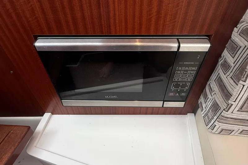 Slide: The Image of Built-in microwave in 2022 Pursuit S 378 Sport boat interior. - 53