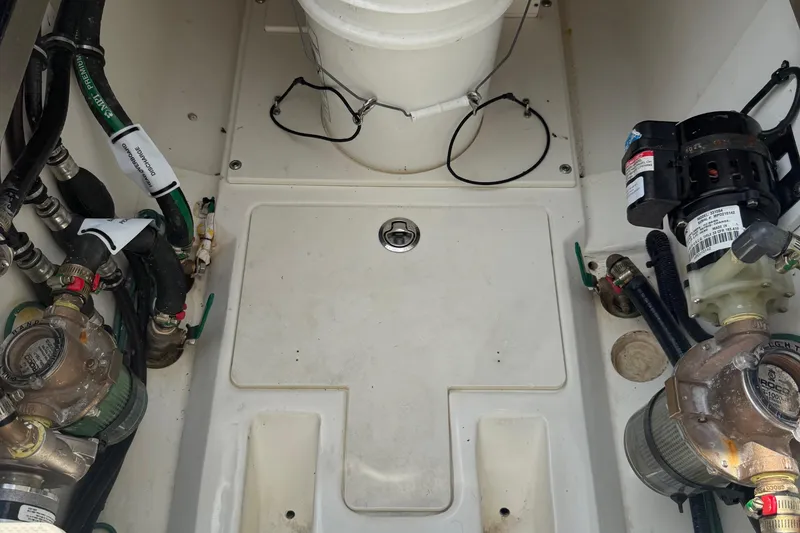 Slide: The Image of Engine compartment of 2022 Pursuit S 378 Sport boat with visible mechanical components. - 65