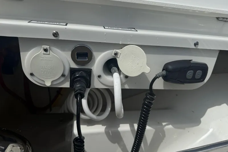 Slide: The Image of 2022 Pursuit S 378 Sport boat washdown and utility connections. - 68