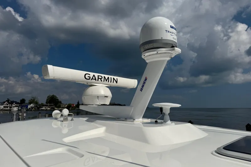 Slide: The Image of 2022 Pursuit S 378 Sport boat with Garmin radar against cloudy sky. - 69