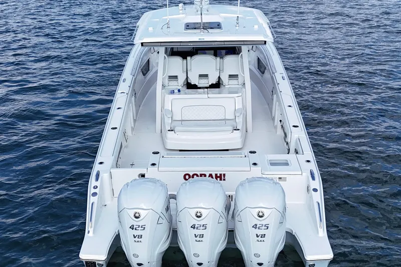 Slide: The Image of 2022 Pursuit S 378 Sport boat with triple 425 V8 engines on water. - 7