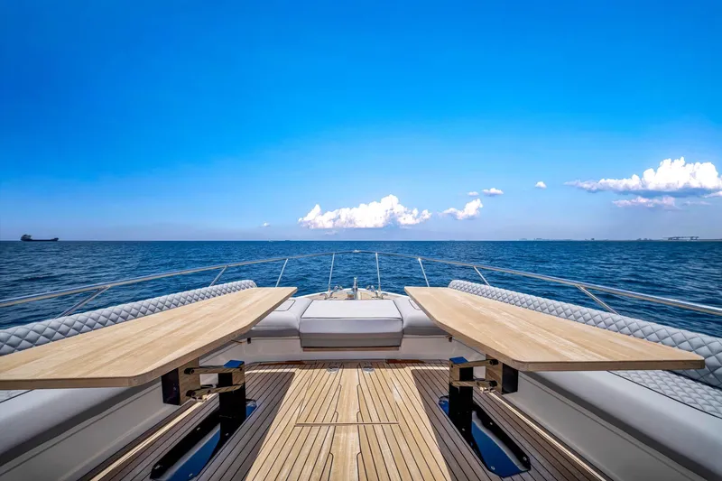 Slide: The Image of Luxurious 2022 Ferretti Yachts 670 deck with ocean view and clear blue sky. - 11