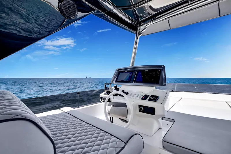 Slide: The Image of Luxurious 2022 Ferretti Yachts 670 helm with ocean view and modern navigation systems. - 16