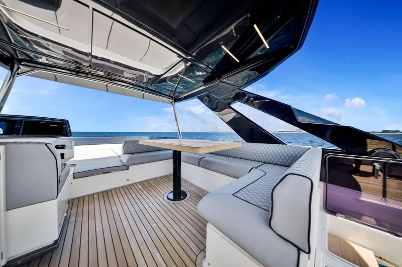 Slide: The Image of Luxurious 2022 Ferretti Yachts 670 with elegant seating and ocean view. - 17