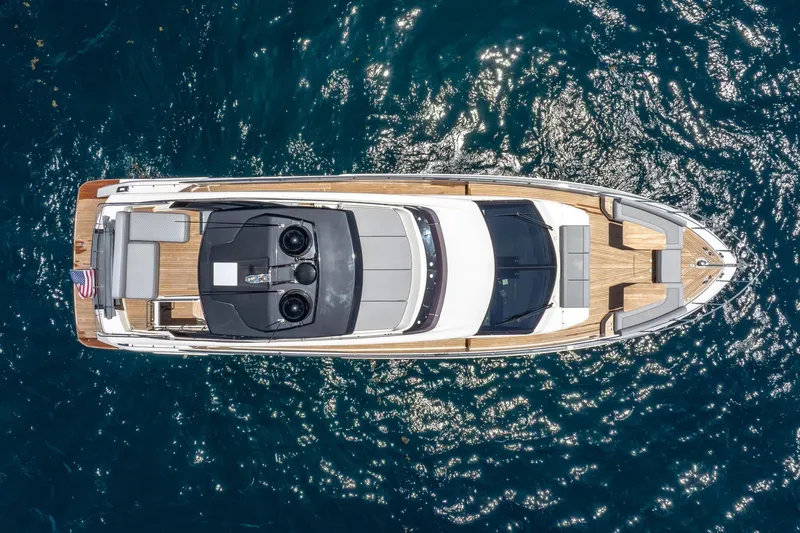 Slide: The Image of Aerial view of 2022 Ferretti Yachts 670 on sparkling blue water. - 2