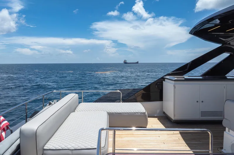Slide: The Image of Luxurious 2022 Ferretti Yachts 670 deck with ocean view and modern seating. - 20