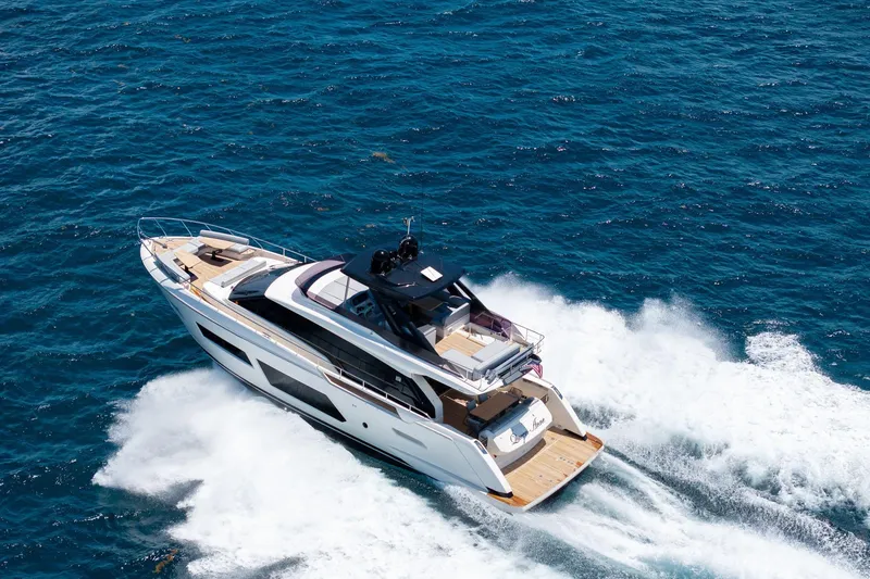 Slide: The Image of Luxurious 2022 Ferretti Yachts 670 cruising on open blue sea. - 3