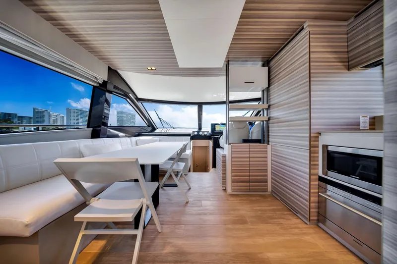 Slide: The Image of Luxurious interior of 2022 Ferretti Yachts 670 with modern dining and kitchen area. - 31