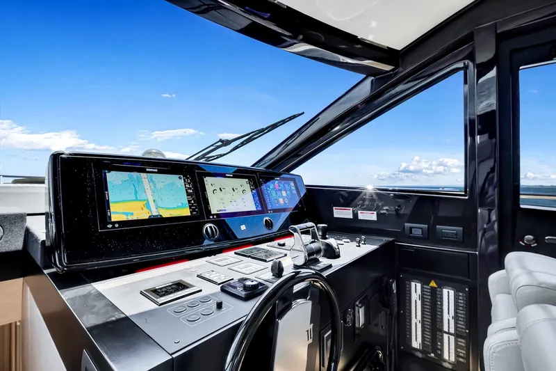 Slide: The Image of Cockpit of 2022 Ferretti Yachts 670 with advanced navigation systems and ocean view. - 36