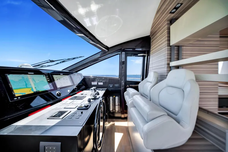Slide: The Image of Luxurious interior of 2022 Ferretti Yachts 670 with modern helm and plush seating. - 37