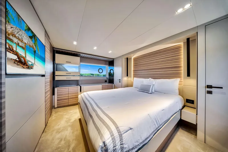 Slide: The Image of Luxurious bedroom interior of 2022 Ferretti Yachts 670 with modern design and scenic artwork. - 41