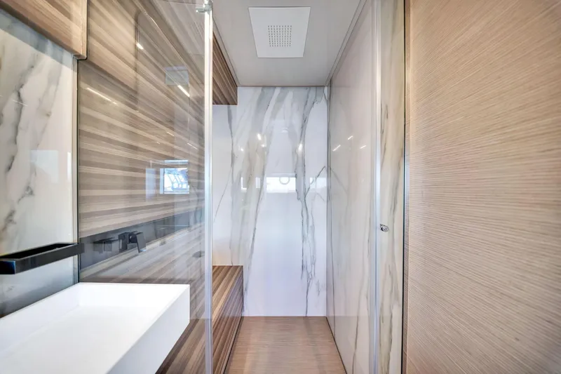 Slide: The Image of Luxurious bathroom interior of 2022 Ferretti Yachts 670 with marble and wood finishes. - 47