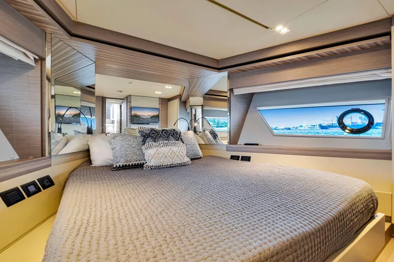 Slide: The Image of Luxurious bedroom interior of 2022 Ferretti Yachts 670 with modern design and ocean view. - 50