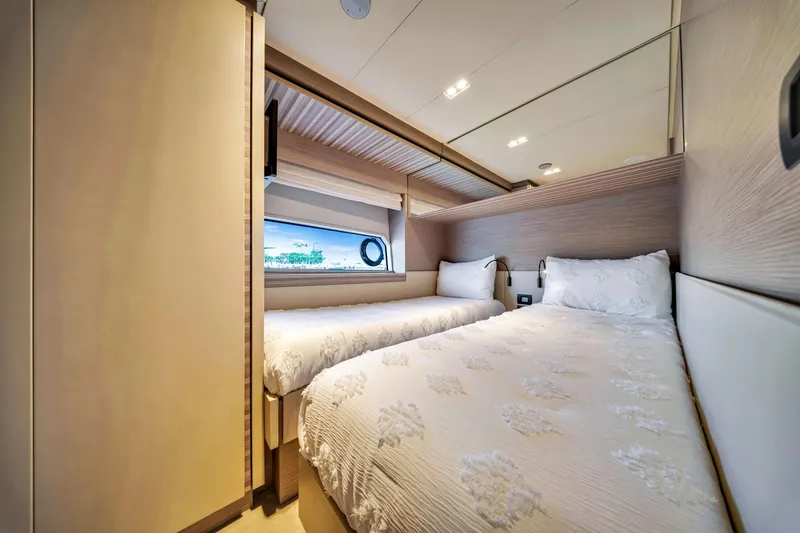 Slide: The Image of Luxurious twin bedroom in 2022 Ferretti Yachts 670, featuring elegant decor and natural light. - 54