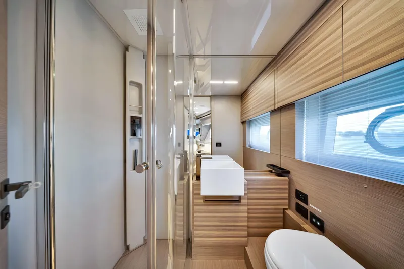 Slide: The Image of Luxurious bathroom interior of 2022 Ferretti Yachts 670 with modern wood finishes. - 57