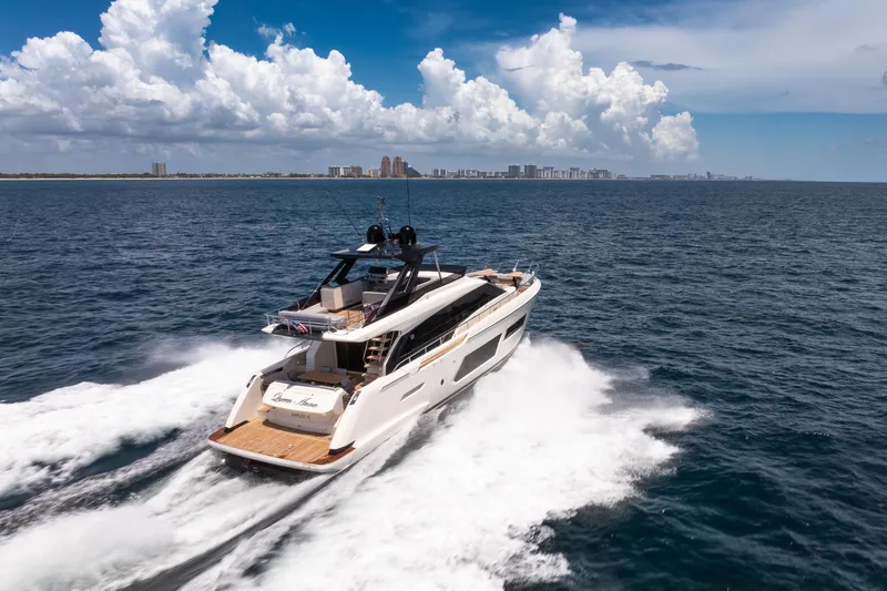 Slide: The Image of 2022 Ferretti Yachts 670 cruising on open sea under a clear blue sky. - 66