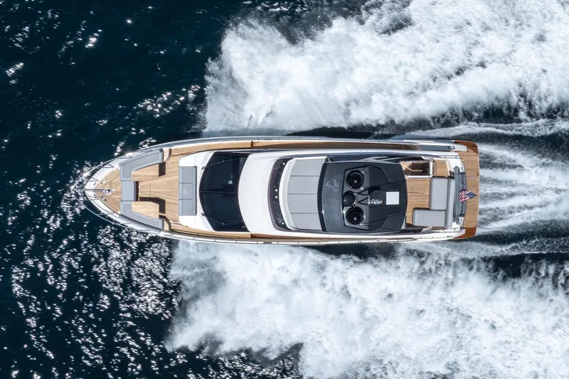 Slide: The Image of Aerial view of 2022 Ferretti Yachts 670 cruising on open water. - 68