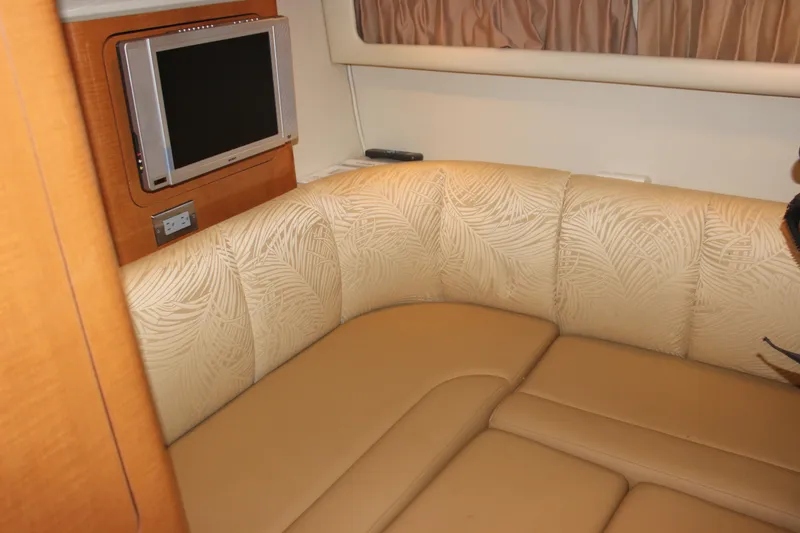 Slide: The Image of 2007 Chaparral Signature 310 interior with beige seating and wall-mounted TV. - 13