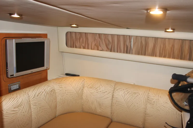 Slide: The Image of Luxurious interior of 2007 Chaparral Signature 310 with TV and plush seating. - 16