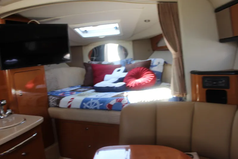 Slide: The Image of 2007 Chaparral Signature 310 interior with cozy bed, TV, and elegant furnishings. - 19