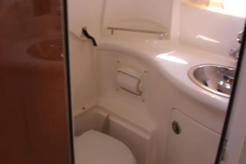 Slide: The Image of 2007 Chaparral Signature 310 boat bathroom with sink and toilet. - 22