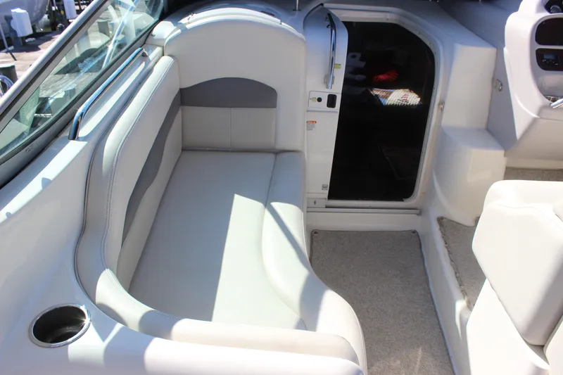Slide: The Image of 2007 Chaparral Signature 310 boat interior with seating and cabin entrance. - 30