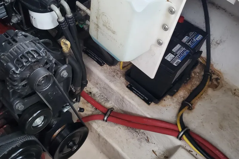 Slide: The Image of Engine compartment of 2007 Chaparral Signature 310 with battery and wiring. - 43