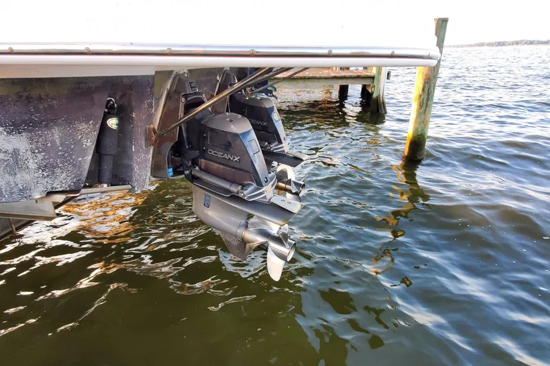 Slide: The Image of 2007 Chaparral Signature 310 boat with OceanX outdrives in water. - 49