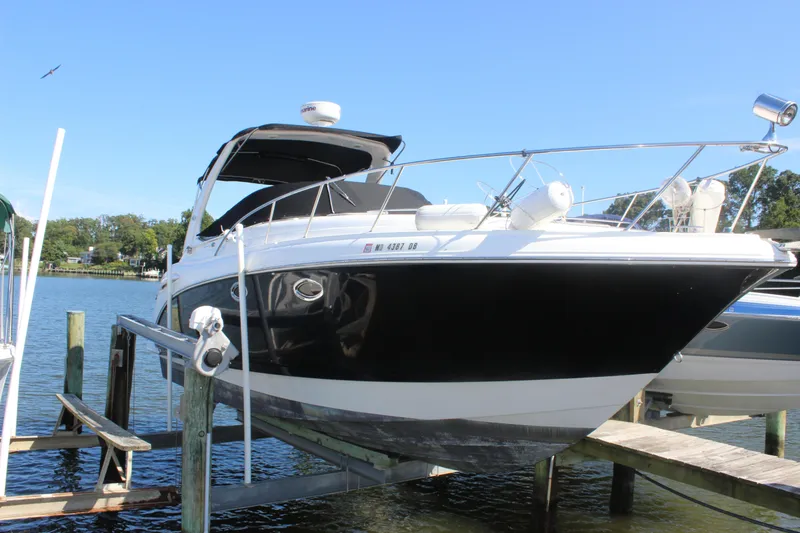 Slide: The Image of 2007 Chaparral Signature 310 boat docked on a sunny day. - 5