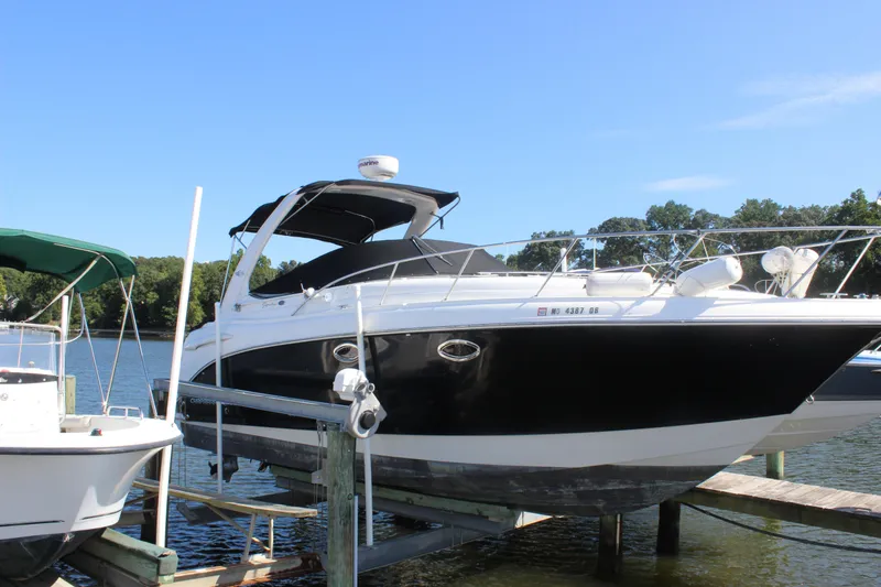 Slide: The Image of 2007 Chaparral Signature 310 boat docked on a sunny day by the lake. - 6