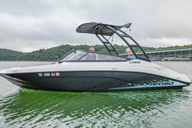 Slide: The Image of 2023 Yamaha AR190 boat on a lake, featuring sleek design and modern features. - 1