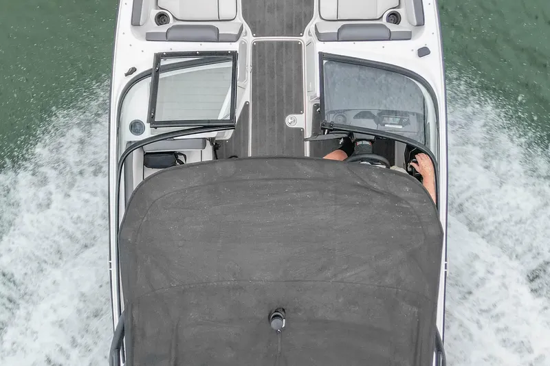 Slide: The Image of Overhead view of 2023 Yamaha AR190 boat cruising on water. - 10