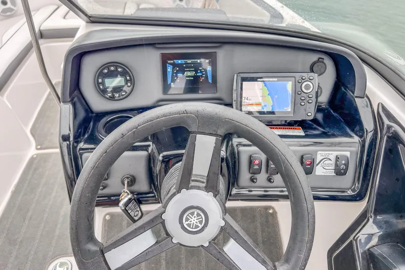 Slide: The Image of 2023 Yamaha Boats AR190 dashboard with steering wheel, navigation display, and control panel. - 18