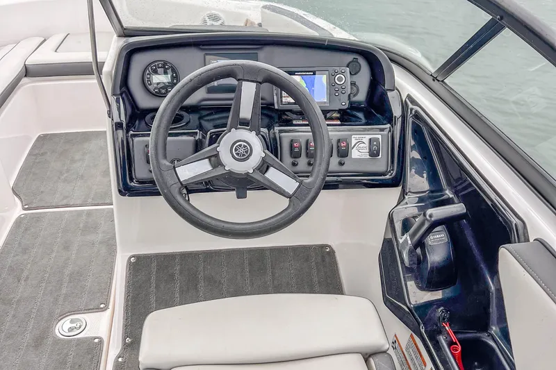 Slide: The Image of 2023 Yamaha Boats AR190 steering console with controls and navigation display. - 19
