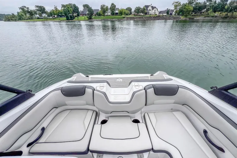 Slide: The Image of 2023 Yamaha Boats AR190 interior with lake view, featuring comfortable seating and sleek design. - 28