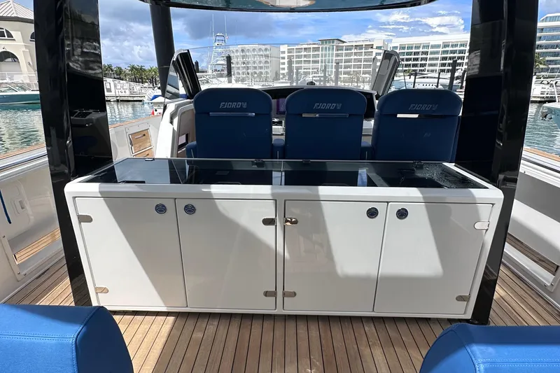 Slide: The Image of 2020 Fjord 44 Open yacht interior with sleek seating and modern cabinetry. - 18