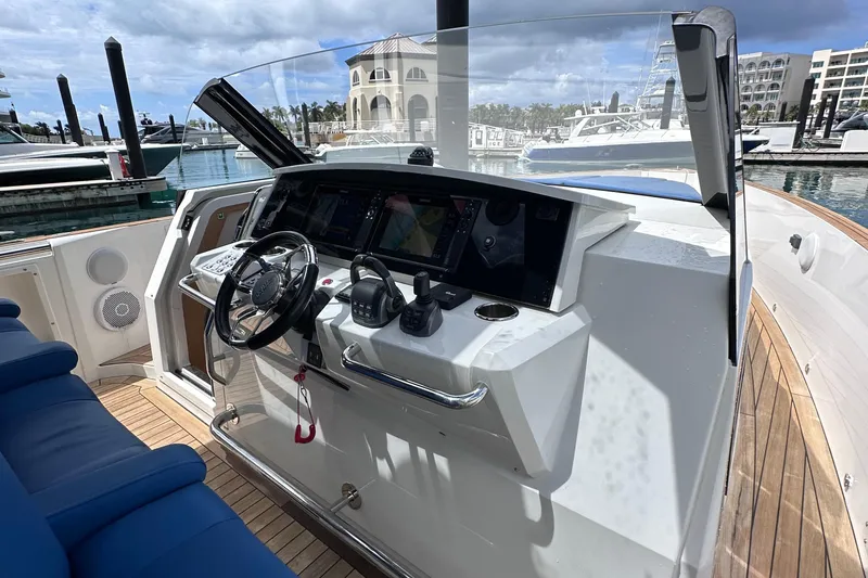 Slide: The Image of Cockpit of 2020 Fjord 44 Open yacht with modern navigation equipment and steering wheel. - 24