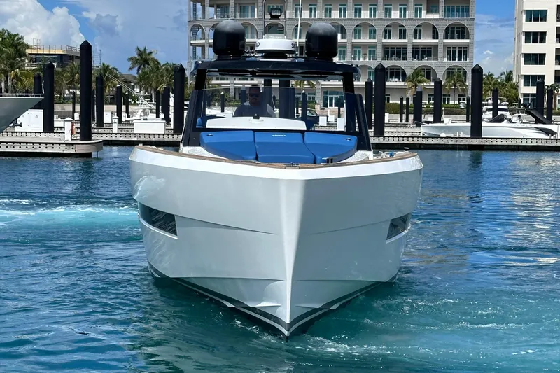 Slide: The Image of 2020 Fjord 44 Open yacht in marina, front view, clear blue water, modern architecture backdrop. - 3