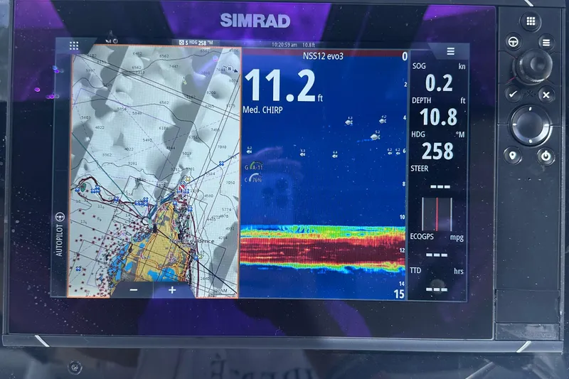 Slide: The Image of Simrad navigation display on 2020 Fjord 44 Open, showing map and sonar data. - 34