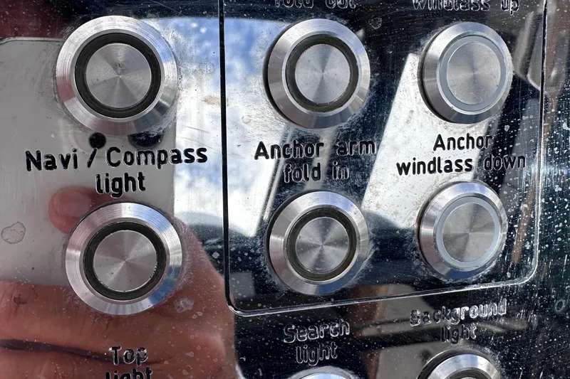 Slide: The Image of Control panel of a 2020 Fjord 44 Open boat with labeled buttons. - 35
