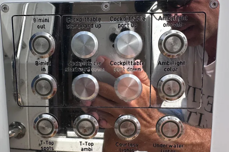 Slide: The Image of Control panel of a 2020 Fjord 44 Open boat with various function buttons. - 36