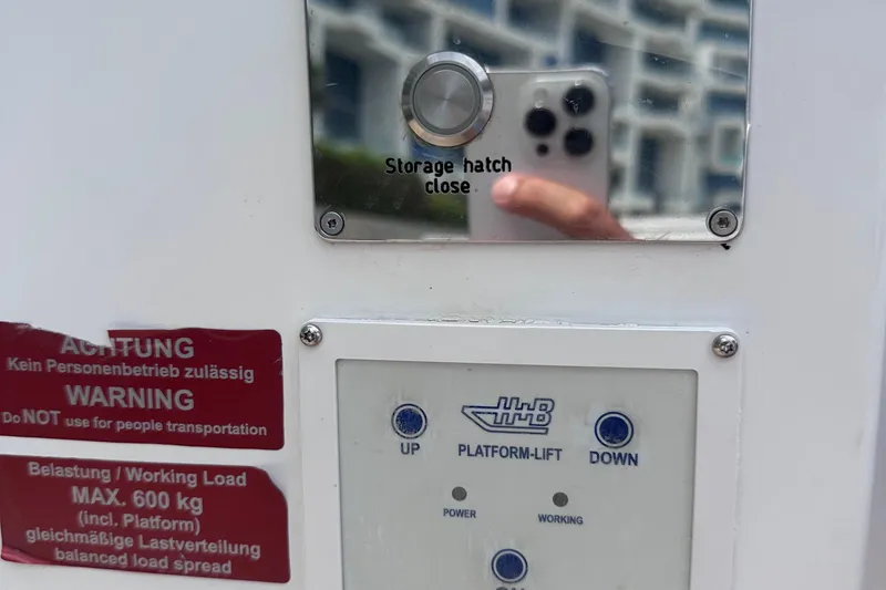 Slide: The Image of Control panel on a 2020 Fjord 44 Open boat with warning labels. - 47