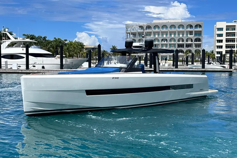 Slide: The Image of 2020 Fjord 44 Open yacht docked in a marina with clear blue water. - 5