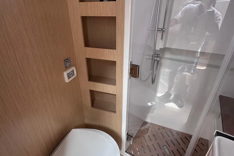 Slide: The Image of Bathroom interior of 2020 Fjord 44 Open yacht with shower and wooden shelving. - 56