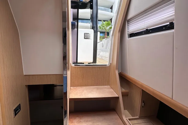 Slide: The Image of Interior view of 2020 Fjord 44 Open yacht with wooden steps and modern design. - 62