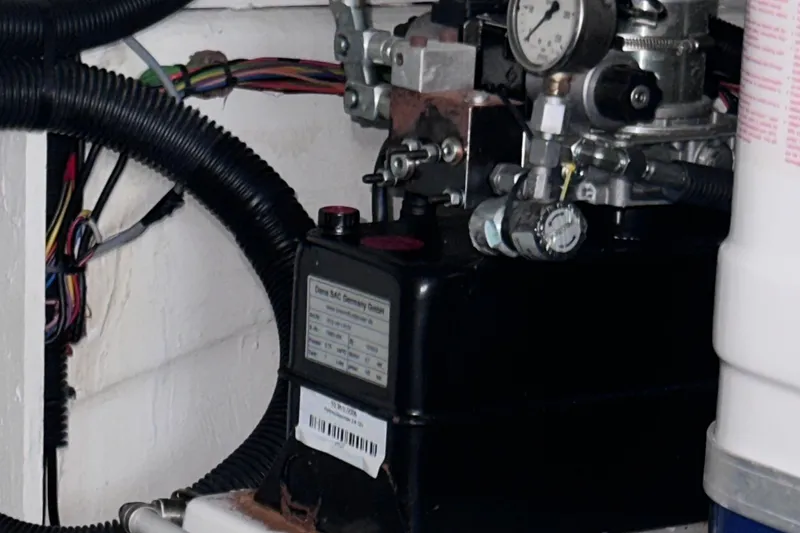 Slide: The Image of Engine compartment of a 2020 Fjord 44 Open boat, showing mechanical components and wiring. - 67