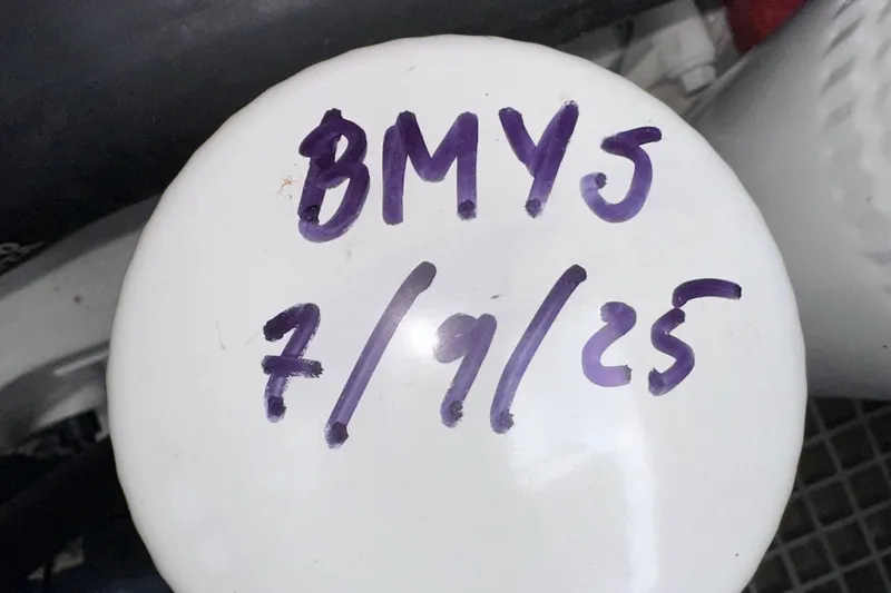 Slide: The Image of White surface with handwritten text 'BMYJ 7/9/25', Fjord 44 Open 2020. - 74